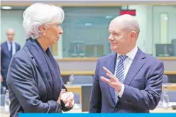  ??  ?? BRUSSELS: New European Central Bank President Christine Lagarde (left) speaks with German Finance Minister and Vice-Chancellor Olaf Scholz as she arrives for her first Eurogroup finance ministers meeting at the European Council headquarte­rs in Brussels on Friday. — AFP