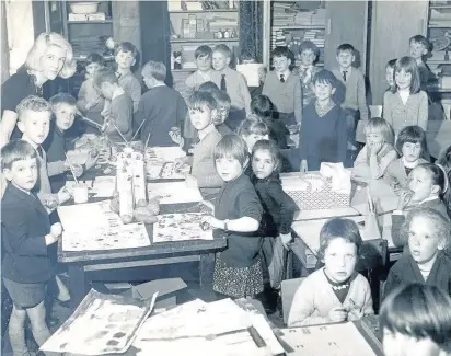  ??  ?? Teacher Norma Petrie, left, and children in class at St Philip’s primary in Southport around the late 60s or early 70s