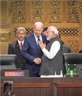  ?? LEON NEAL/GETTY IMAGES ?? President Joe Biden chats with Prime Minister Narendra Modi of India ahead of a working session on food and energy security during the G20 Summit on Tuesday in Nusa Dua, Indonesia.