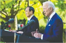  ?? GETTY IMAGES FILES ?? U.S. President Joe Biden, right, may sign a digital trade pact with Japan's Prime Minister Yoshihide Suga and others.