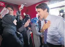  ?? PAUL CHIASSON/THE CANADIAN PRESS ?? The latest polls suggest Liberal Leader Justin Trudeau has the support of 52.9 per cent of Papineau voters versus just 18 per cent for his NDP opponent, Anne Lagacé Dowson.