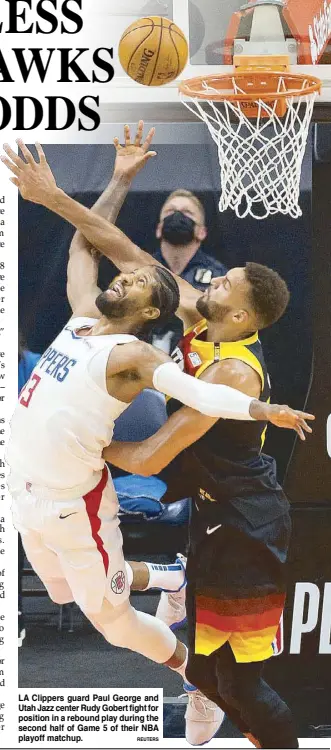  ?? REUTERS ?? LA Clippers guard Paul George and Utah Jazz center Rudy Gobert fight for position in a rebound play during the second half of Game 5 of their NBA playoff matchup.