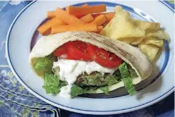  ?? [SARA MOULTON VIA AP] ?? A spinach and feta burger with a cucumber yogurt sauce.