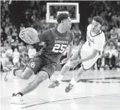  ?? GARETT FISBECK AP ?? Oklahoma guard Grant Sherfield, who finished with 30 points, drives past Alabama guard Rylan Griffen.