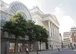  ?? SANG TAN AP ?? In this Aug. 11, 2009, file photo, people walk by the Royal Opera House in central London. The opera is selling a David Hockney painting of its former chief to help it stay afloat during the cornavirus pandemic.