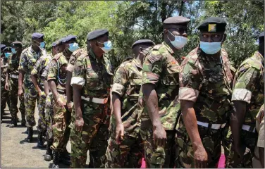  ?? (AP) ?? Kenya Defense Forces soldiers line up to get coronaviru­s shotsThurs­day at the Kahawa Garrison near Nairobi. As Africa lags in its efforts to vaccinate its 1.3 billion people, the continent must develop the capacity to produce its own vaccines, Dr. John Nkengasong, the director of the Africa Centers for Disease Control and Prevention, said at a news briefing.