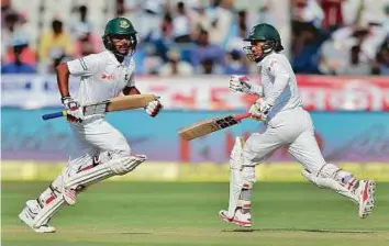  ?? AP ?? Bangladesh’s captain Mushfiqur Rahim (right), and Mehedi Hasan run between the wickets during the third day of the cricket test match against India in Hyderabad, India yesterday.