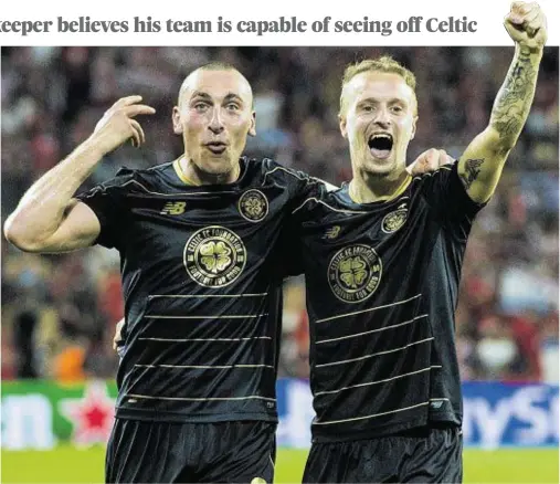  ??  ?? DELIRIOUS DISBELIEF: Celtic captain Scott Brown, left, and Leigh Griffiths cannot contain their joy on the final whistle