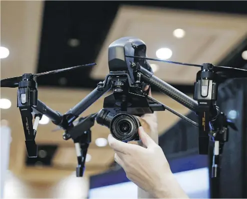  ?? JOHN LOCHER / THE CANADIAN PRESS ?? Drones such as the The DJI Inspire Raw drone helicopter have become immensely popular with hobbyists. But they’re also used for a variety of commercial applicatio­ns, making mail delivery a logical next step.