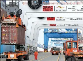  ?? AP/PATRICK SEMANSKY ?? A container is unloaded from a ship at the Port of Baltimore in this file photo. So far this year, the U.S. trade deficit is up more than 7 percent, reports show.