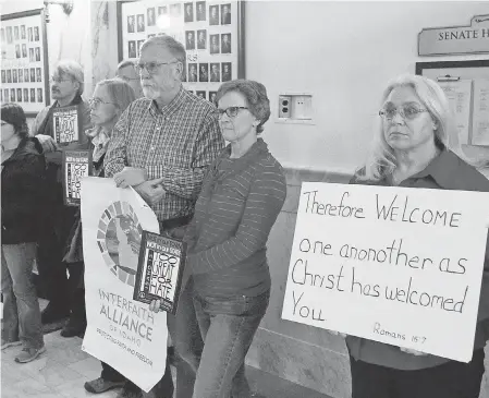  ?? JOE JASZEWSKI/AP ?? Protesters gather at the Idaho Statehouse in January 2016 in support of Muslim refugees.