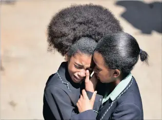  ?? PICTURE: PHILL MAGAKOE ?? CLAIMS OF RACISM: Pupils of Pretoria Girls’ High School comfort each other after a meeting with Gauteng Education MEC Panyaza Lesufi at the school yesterday.