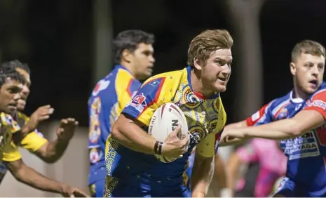  ?? PHOTO: KEVIN FARMER ?? TRIAL GAME South West Emus player Braydon Mitchell takes on the TRL All Stars defence during their pre-season trial game earlier this year. The two teams will face off again in 2018 in a curtain-raiser match for the Brisbane Broncos and Gold Coast...