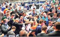  ?? OLSON/GETTY IMAGES/AFP SCOTT ?? Traders signal offers in the S&amp;P options pit at the Cboe Global Markets exchange shortly after the US Federal Reserve announced it was raising interest rates on September 26, 2018 in Chicago, Illinois.