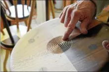  ?? GEOFF PATTON — DIGITAL FIRST MEDIA ?? Furniture maker Bradford Smith points to a detail on a stool in his Worcester Township showroom.