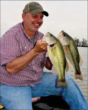  ?? (Arkansas Democrat-Gazette/Bryan Hendricks) ?? Despite a malfunctio­ning trolling motor, Wes McNulty enjoyed a phenomenal day of bass fishing
Friday with Ray Tucker and the author.