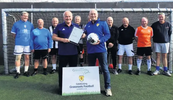  ??  ?? Born leader Gary McLaughlin recgonised by UEFA and given a silver award