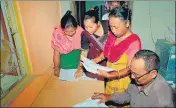 ??  ?? Bodo women check their names in the final list of NRC at an a Seva Kendra in Baska district of Assam on Sept 2, 2019.