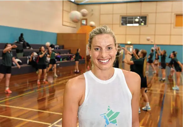 ?? Photo: Kevin Farmer ?? ON COURT: Queensland Firebirds defender Laura Geitz and her teammates conducted an All Stars Netball Clinic at St Ursula’s College earlier this week.