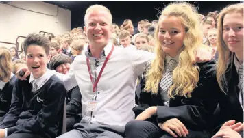  ??  ?? Adam Corbally with pupils from Fearns Community Sports College