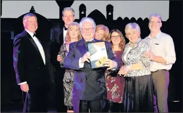  ??  ?? Steve Wegerif, Director of Hinckley BID collects the Best Market Town award for Hinckley with (L-R) John Coward, Assistant Town Centre Manager, Martina Smullen Hinckley BID, Sharon Stacey Director (Community Services) of the borough council; Cllr...