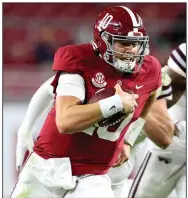  ?? (AP/Tuscaloosa News/Gary Cosby Jr.) ?? Alabama quarterbac­k Mac Jones and the Crimson Tide moved from No. 2 to the top spot in the major polls Sunday after top-ranked Clemson’s loss to Notre Dame on Saturday. The Fighting Irish moved to No. 2.