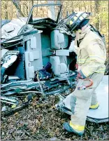  ?? Courtesy of Lucky Koucky at the
Bella Vista Fire Department ?? A firefighte­r with the Bella Vista Fire Department surveys the scene of single-vehicle accident Nov. 6 on Arkansas 340 near Bedlington Lane. The Driver, Christina Cassidy of Garfield, ran off the road after leaving Ozark Beverage Co. early in the...