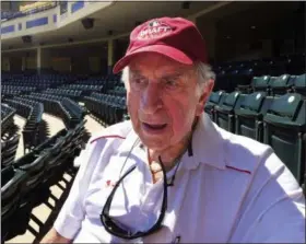  ?? PAUL NEWBERRY — THE ASSOCIATED PRESS FILE ?? In this file photo, Tommy Giordano, special assistant to the general manager of the Atlanta Braves, sits in the stands after the team’s spring training baseball workout, in Kissimmee, Fla. T-bone (a nickname that goes back to his days growing up in New Jersey, when his father would always make him a steak as a pregame meal) had every intention of coming back for his 72nd season _ staked out behind home plate, a stopwatch in one hand, a lineup card in his lap.