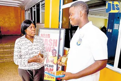  ?? JIS ?? Head of the Business Education Department at the José Martí Technical High School in St Catherine, Maxine McCay, in discussion with top business student at the institutio­n, Laterell McKenzie, during the recent Founder’s Day Celebratio­ns and Awards Ceremony.