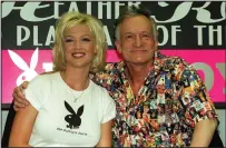  ??  ?? Hugh Hefner in 1999 with Playmate, Heather Kozar