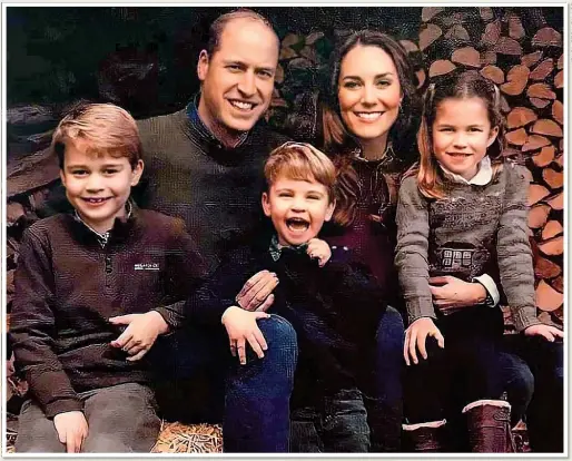  ??  ?? FESTIVE FUN: William and Kate strike a wintery pose for the family Christmas card with Louis, centre, George, left, and Charlotte