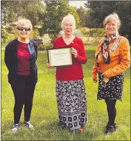  ??  ?? Anna Bellinger is presented with a certificat­e and pin fromthe Chester County Chapter of the DAR by Kathleen Conway, who nominated her for the award, and Sarah Cass, American Heritage Committee Chair.