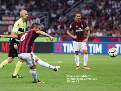  ??  ?? Suso curls Milan’s winner from a freekick Photo AP