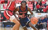  ?? (AP photo/David Dermer) ?? Detroit Mercy guard Antoine Davis drives against Youngstown State guard Myles Hunter Thursday during the first half of an NCAA college basketball game.