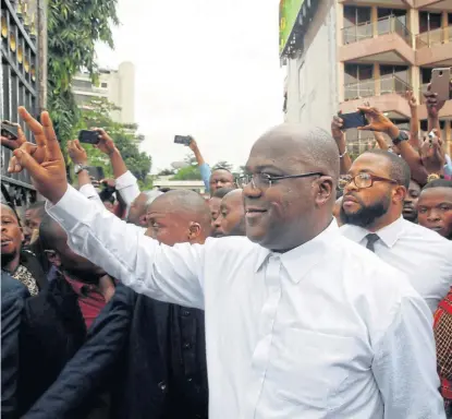  ?? /Reuters ?? The surprise winner: Felix Tshisekedi, leader of the Union for Democracy and Social Progress, the main opposition party in the DRC, gestures to his supporters in Kinshasa on Thursday after he was announced the winner of the presidenti­al election.