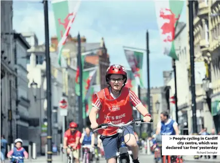  ?? Richard Swingler ?? &gt; People cycling in Cardiff city centre, which was declared ‘car free’ yesterday