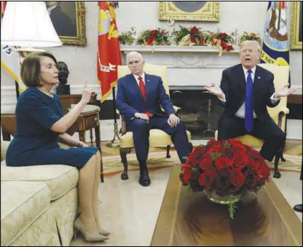  ?? EVAN VUCCI / AP ?? President Donald Trump and Vice President Mike Pence, second from left, meet Dec. 11 with then-House Minority Leader Nancy Pelosi, D-Calif., and Senate Minority Leader Chuck Schumer, D-N.Y., (not shown) in the Oval Office. During the meeting, Trump told the Democratic leaders he would be “proud” to shut down the government if Congress didn’t provide funding for a border wall.