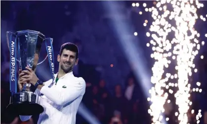  ?? ?? Novak Djokovic with the Nitto ATP Finals trophy after his straight-sets victory over Norway's Casper Ruud. Photograph: Guglielmo Mangiapane/Reuters