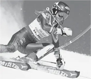  ?? JEAN- CHRISTOPHE BOTT, EPA ?? The USA’s Mikaela Shiffrin clears a pole on a slalom run last weekend en route to victory in the event at the world championsh­ips in St. Moritz, Switzerlan­d.