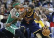  ?? RON SCHWANE — ASSOCIATED PRESS FILE ?? Cleveland Cavaliers’ Kyrie Irving, right, looks to drive against Boston Celtics’ Isaiah Thomas during a game in Cleveland last November.