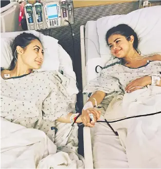  ??  ?? Close friends: Francia, left, holds Selena’s hand after the successful operation