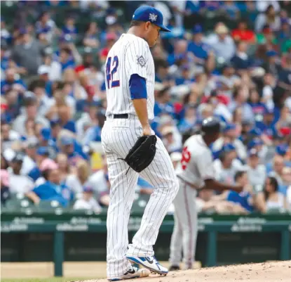  ?? KAMIL KRZACZYNSK­I/ AP ?? Cubs left- hander Jose Quintana allowed six runs and nine hits in 4‰ innings Monday against the Braves.