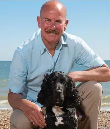  ??  ?? Besotted: Nick with his hearing dog saviour, Yorick