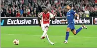  ?? PHOTO: EPA-EFE ?? Ajax’s Carlos Forbs, left, scores against Olympique de Marseille in their UEFA Europa League Group B match in Amsterdam, Netherland­s, on Thursday.