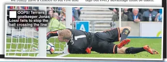  ??  ?? OOPS! Terriers goalkeeper Jonas Lossl fails to stop the ball crossing the line