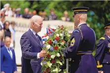  ?? ANDREW HARNIK/ASSOCIATED PRESS ?? President Joe Biden lays a wreath at The Tomb of the Unknown Soldier at Arlington National Cemetery on Memorial Day in Arlington, Va.