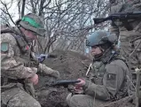  ?? SERGEY SHESTAK/AFP VIA GETTY IMAGES ?? Soldiers of the Ukrainian Volunteer Army hold their positions at the front line near Bakhmut, Donetsk region, on Saturday.