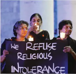  ??  ?? Women hold placards during a silent protest titled "Women in Black for Peace" on the eve of Internatio­nal Women's Day in Bangalore on Saturday. Internatio­nal Women's Day is marked on March 8 every year and is a global day celebratin­g the economic,...