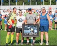  ?? PHOTO COURTESY ROSE MARY BARNHART ?? FC Kansas City goalkeeper Nicole Barnhart, left, is joined by her family, from left, sister Valerie, and parents Kimber and Rose Mary, upon being recognized for her 100th NWSL regular season game on Sept. 3.