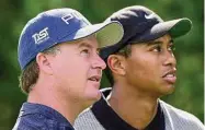  ?? Scott Audette/Associated Press ?? Bob May, left, along with with Tiger Woods, watches a tee shot fall on the seventh fairway during the National Car Rental Golf Classic at Walt Disney World in Lake Buena Vista, Fla. in 2000.